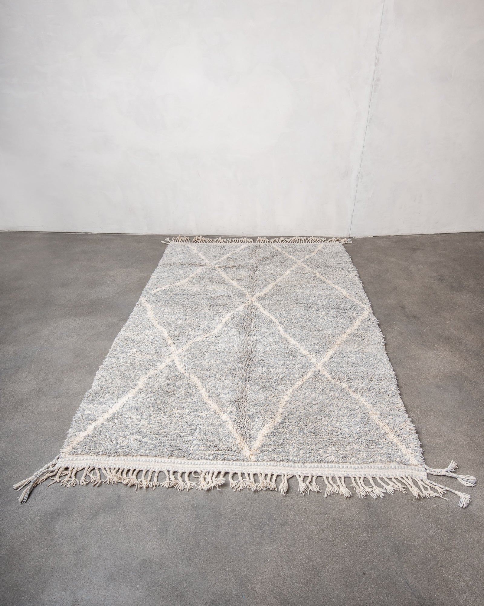 Modern, designer, handcrafted Berber rug from Morocco. Beniourain carpet with beautiful colours and patterns and fluffy wool texture.